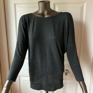 Lole top with 3/4 sleeves and criss cross back opening.